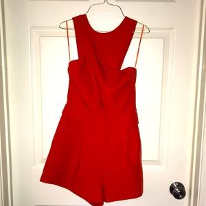 Finders Keepers size small orange romper.
